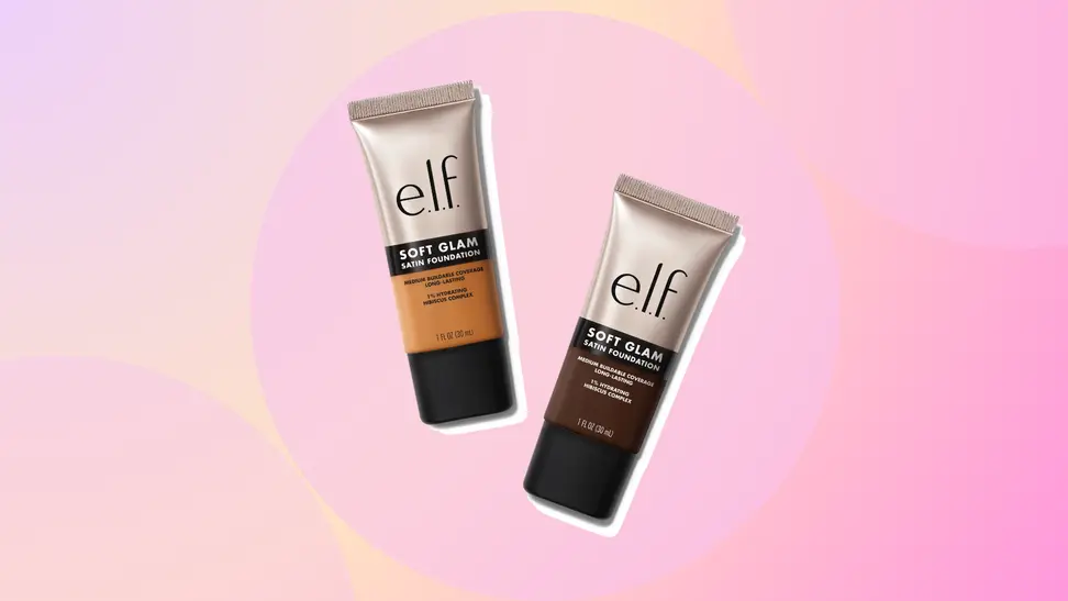 Two tubes of the ELF Cosmetics Soft Glam Satin Foundation against a purple orange and pink background