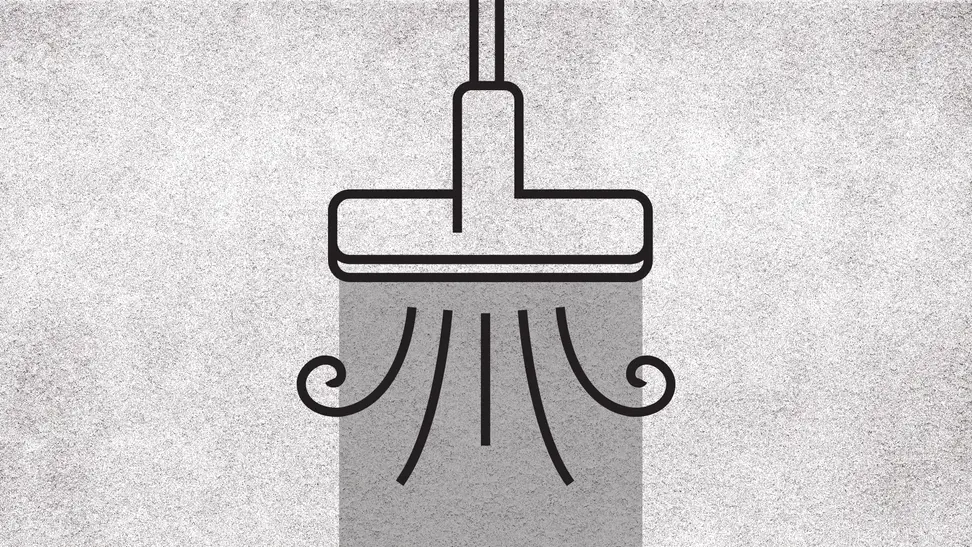 A graphic of a vacuum sucking up a rug