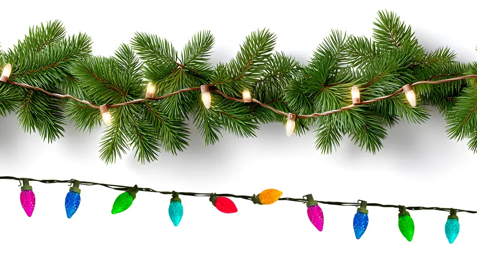 White string lights on evergreen garland above a string of colored lights