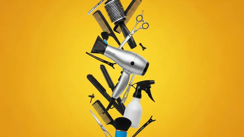 Hair styling tools and accessories against a yellow background