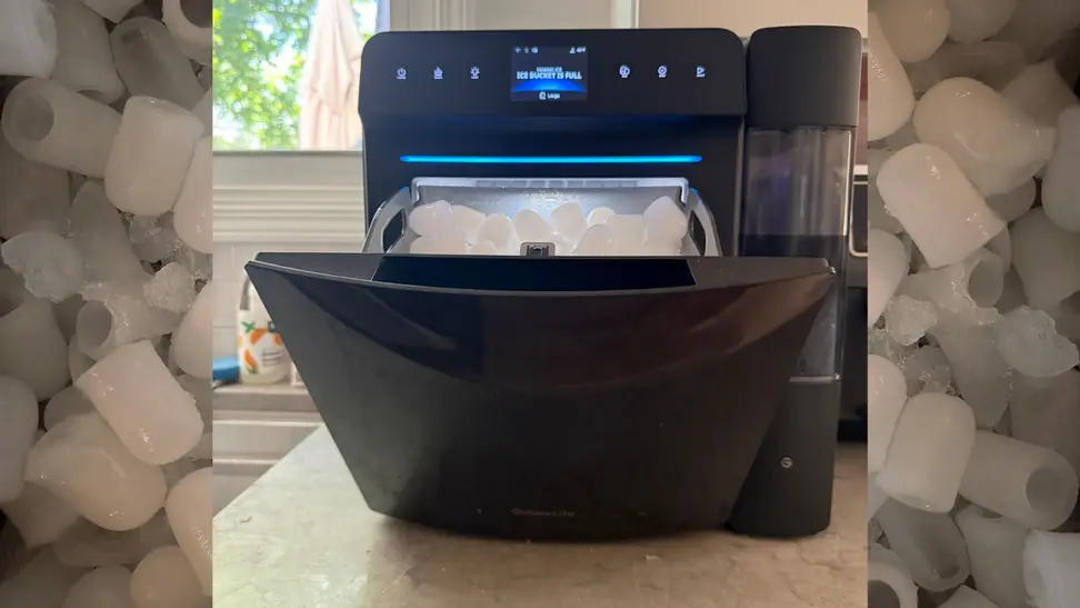 Black Govee Smart Countertop Ice Maker 2 on a kitchen counter, open and showing ice inside.