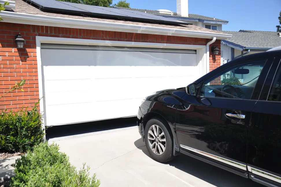 A car parked outside of a home