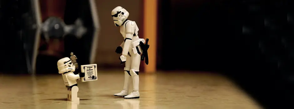 Storm Trooper kid is giving Storm Trooper dad the droid he has always been looking for.